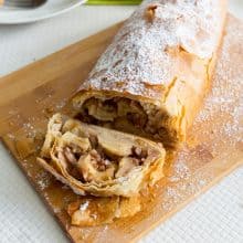 A sliced apple strudel on the table.