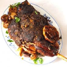 A platter slow roasted leg of lamb.