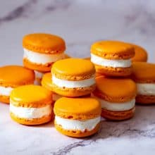 Orange flavor macarons on the table.