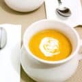 A bowl of pumpkin and sweet potato soup.