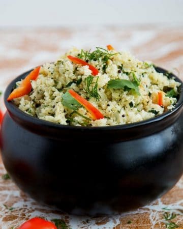 A bowl of cauliflower rice with mustard and dill