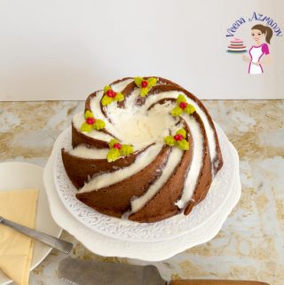 An eggnog bundt cake on a cake stand.