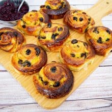 Danish pastry on a wooden board.