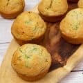 Zucchini muffins on a wooden tray.
