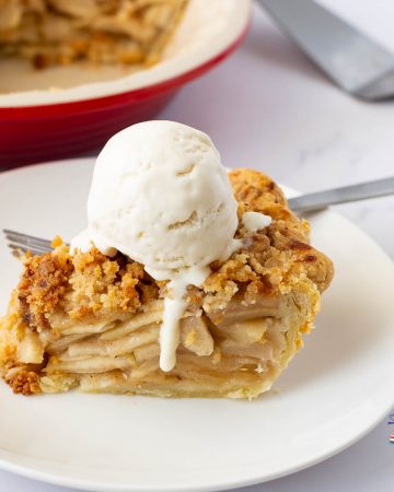 A plate of apple pie with vanilla ice cream