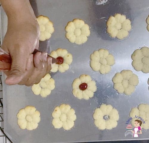 Fill the cookie centers with jam