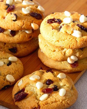 White chocolate cranberry cookies on a table.